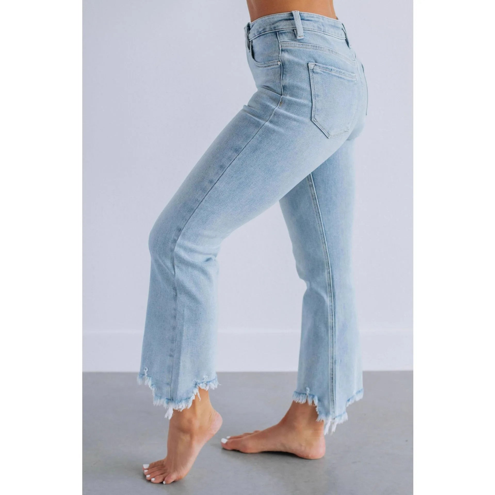 Women's solid colour cotton denim jeans with manual distressing in dark blue and light blue options