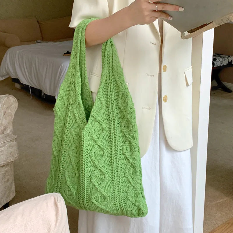 Retro hollow knitted wool yarn women's shoulder tote bag in solid colour showing double straps.