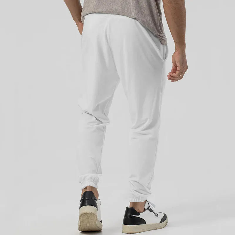 Men's grey cotton blend track sweatpants with elastic waistband and straight-leg design