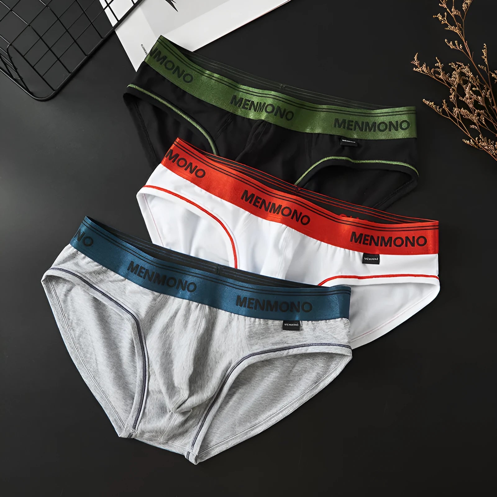 Men's low waist cotton briefs in a black and blue colour combination.