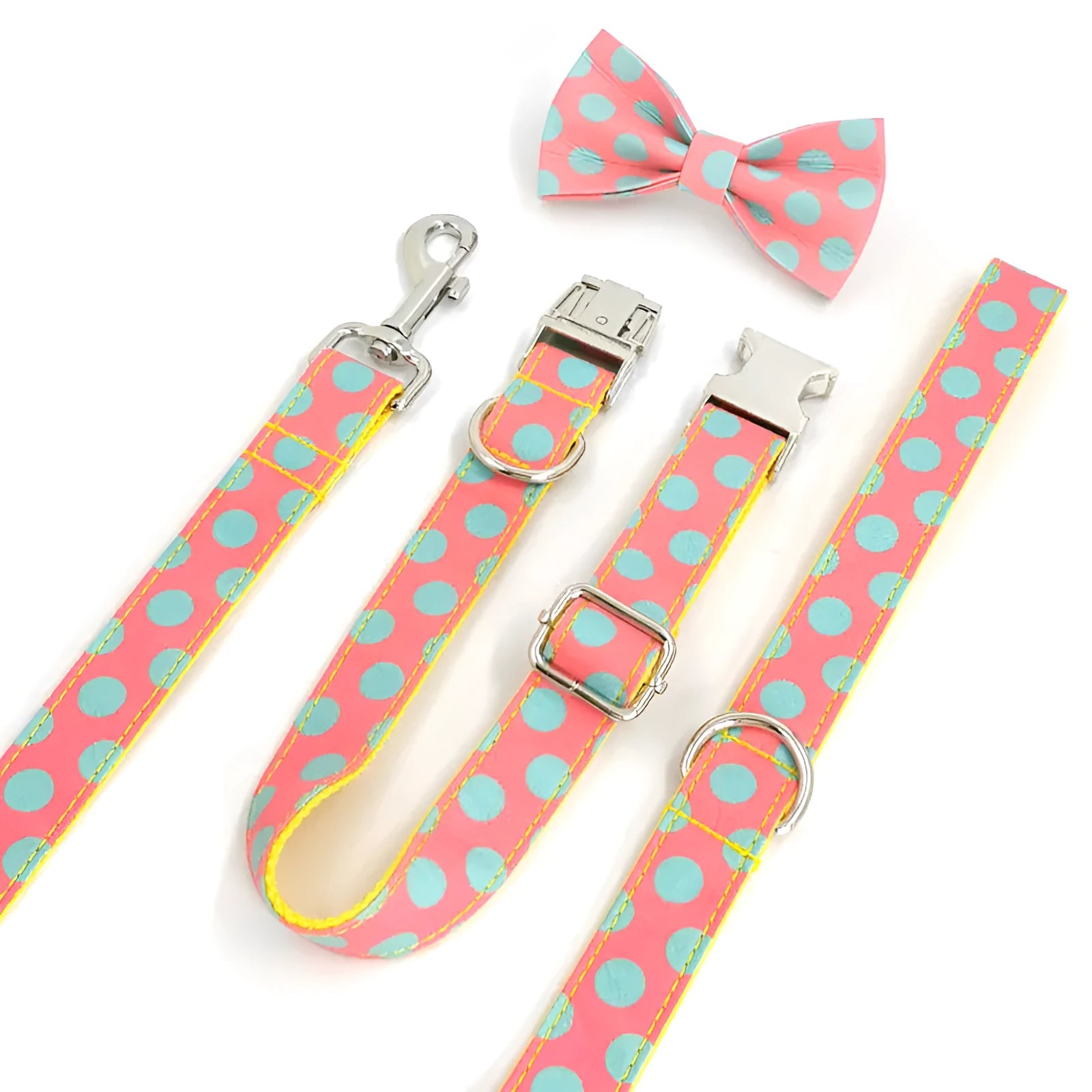 Yellow polka dot pet collar and matching hand-held traction rope lead set on plain background