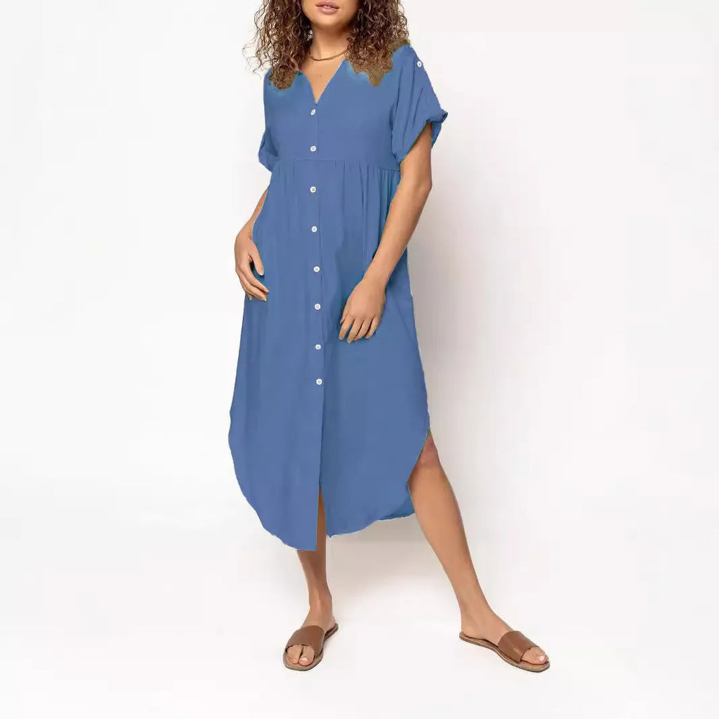 A loose-fitting, solid-colour button-down midi dress on a hanger, shown in apricot colour.