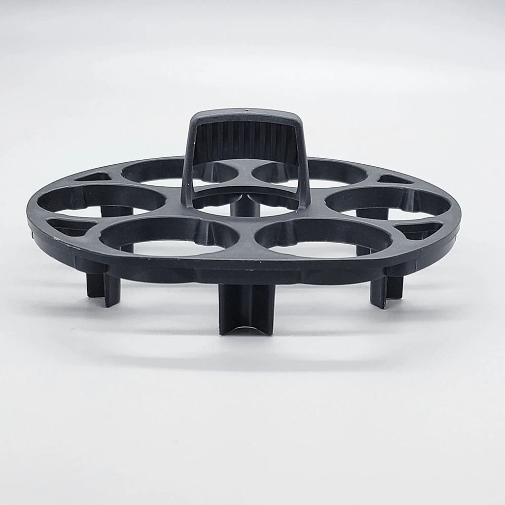 Black plastic egg storage rack with modern design on a kitchen counter