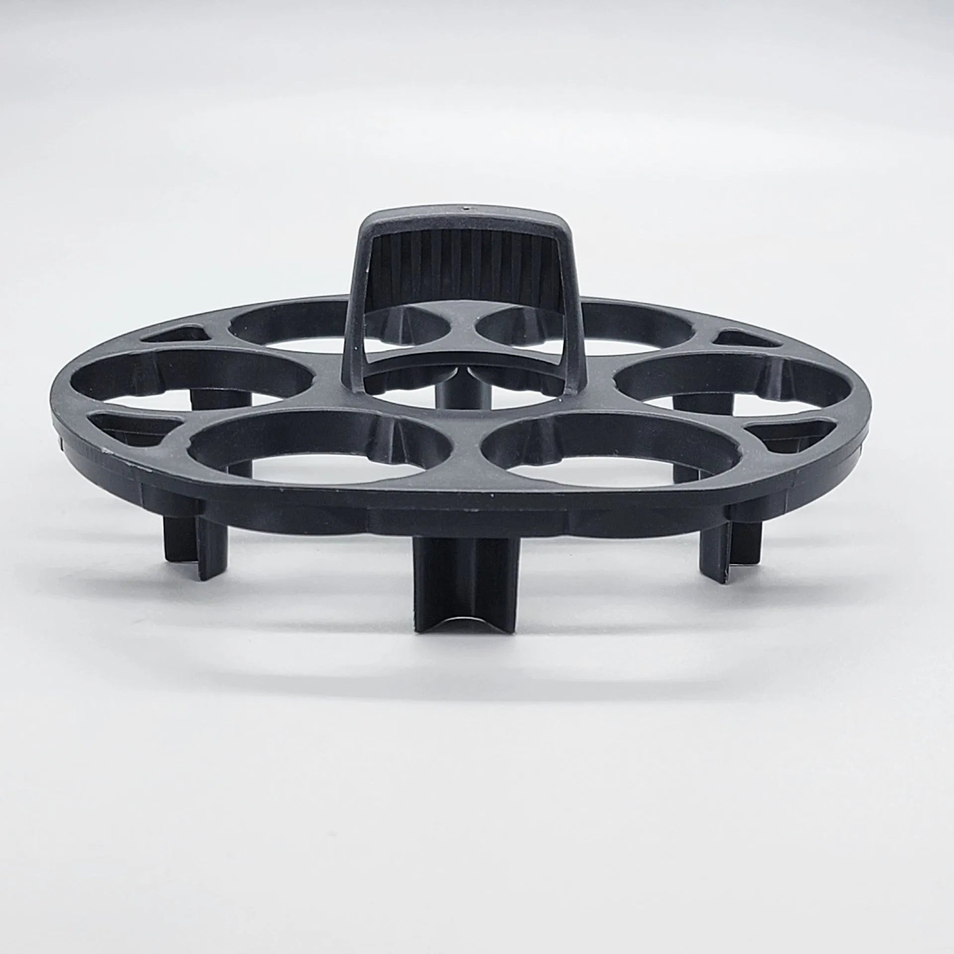 Black plastic egg storage rack with modern design on a kitchen counter