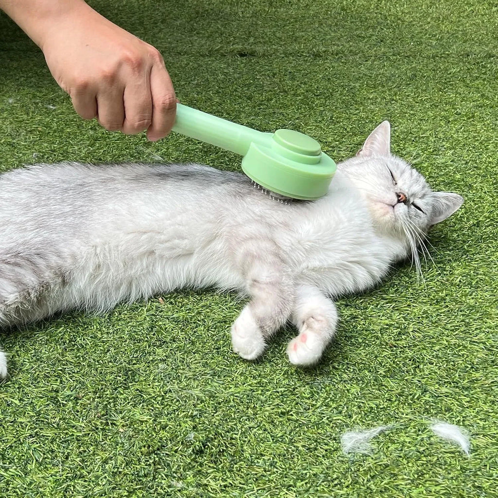 Green and yellow 2-in-1 pet grooming brush with stainless steel teeth and a hanging loop