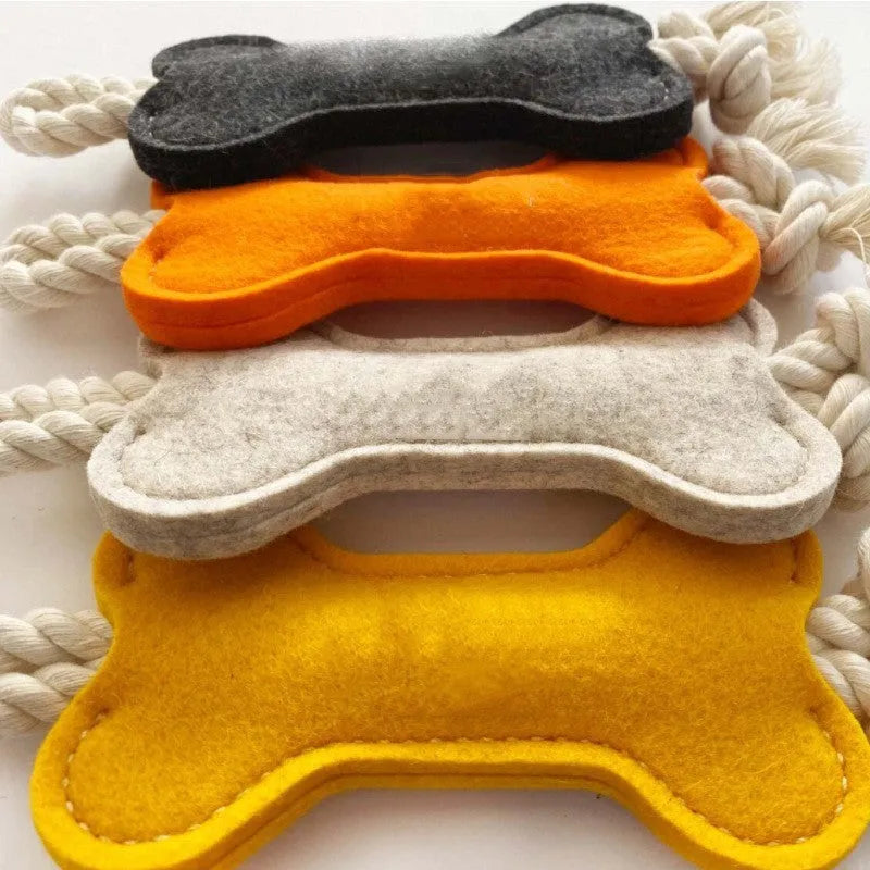 Bone-shaped dog toy with rope knot and felt construction in four colour options