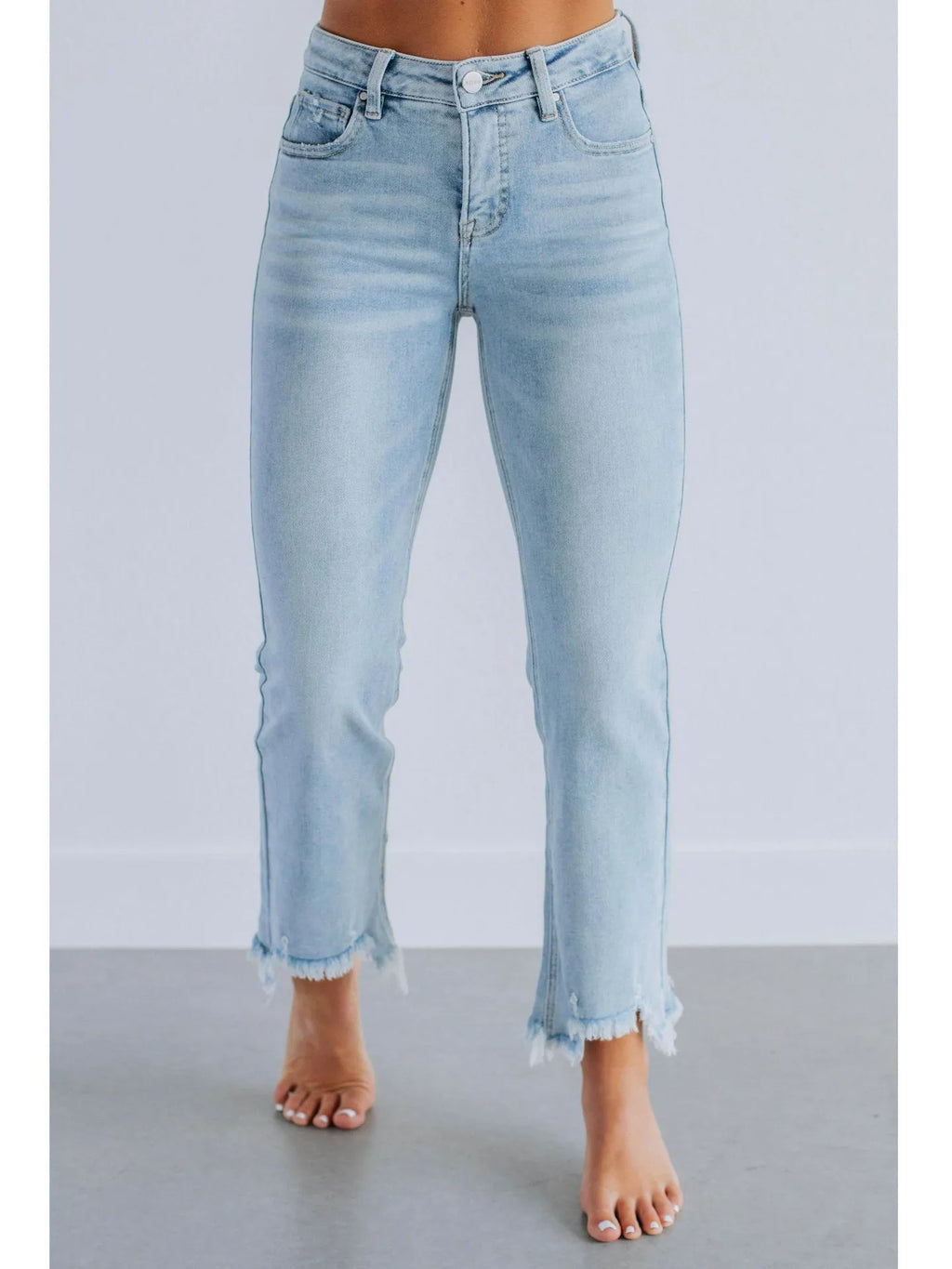 Women's solid colour cotton denim jeans with manual distressing in dark blue and light blue options