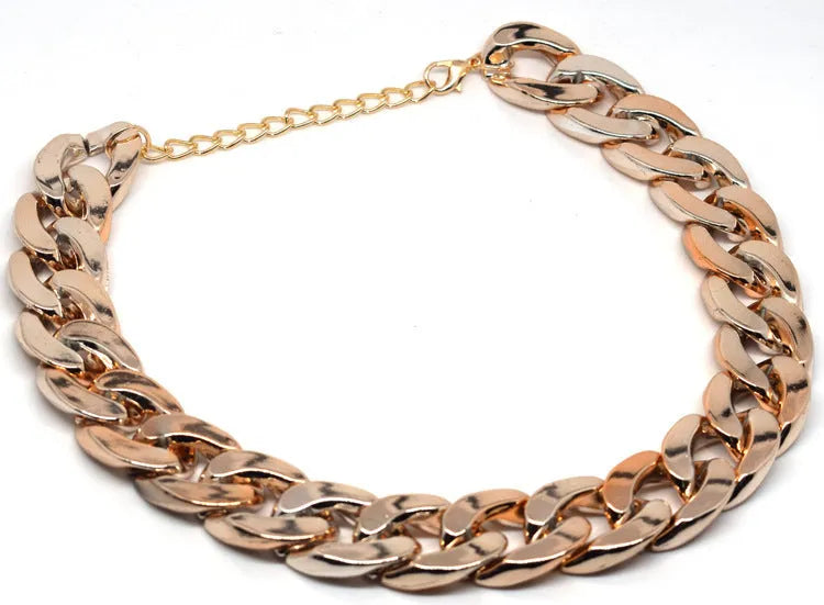 Adjustable geometric chain dog collar in gold or white for small to medium dogs.