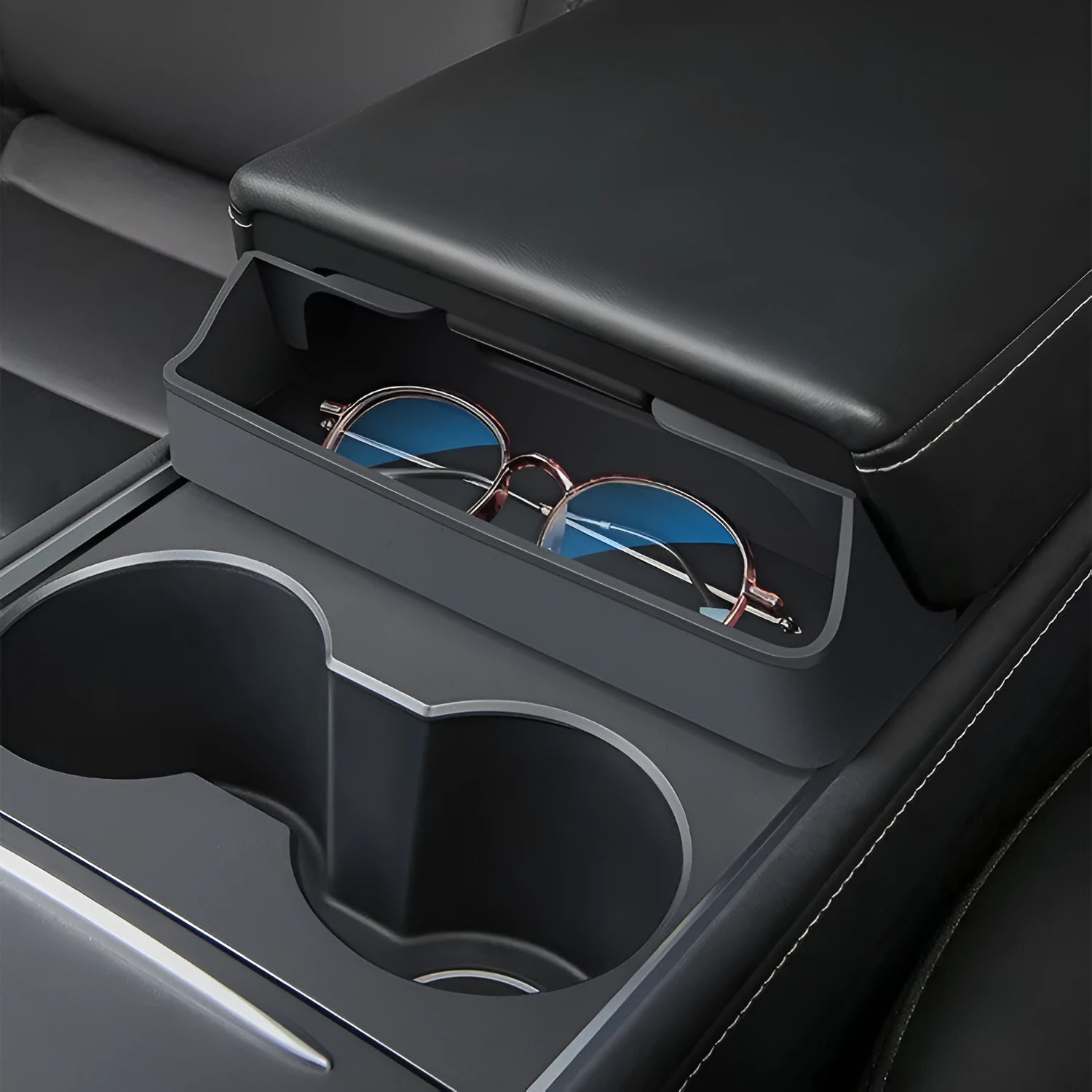 Black silicone car glasses case attached to Tesla Model 3 armrest box for sunglasses storage