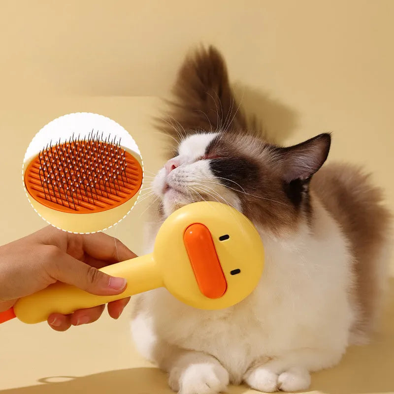 Small yellow duck pet grooming comb with fine needles and open section hair collection design