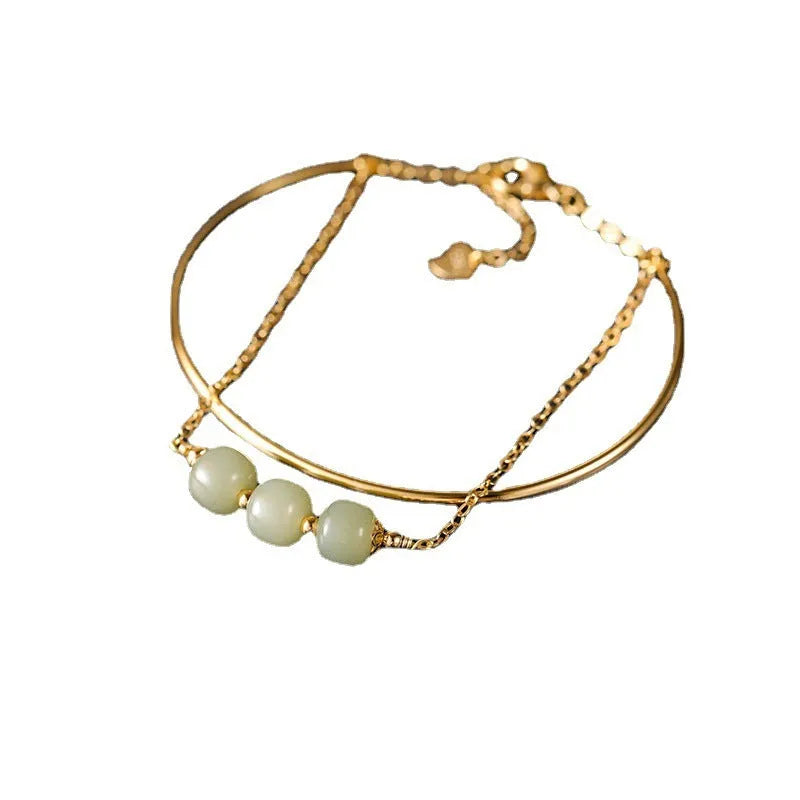 Women's Hetian jade lucky bead bracelet with gold inlay, showing single, double, and three bead version options.