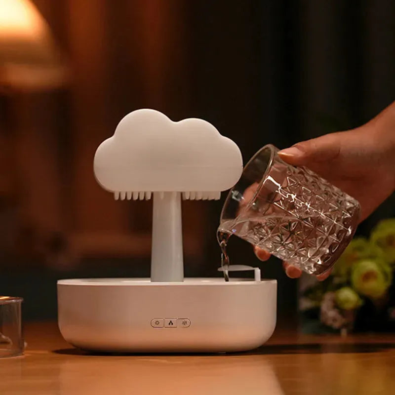 Rain cloud night light humidifier with 7 colour LED lights and raining water drop sound in white