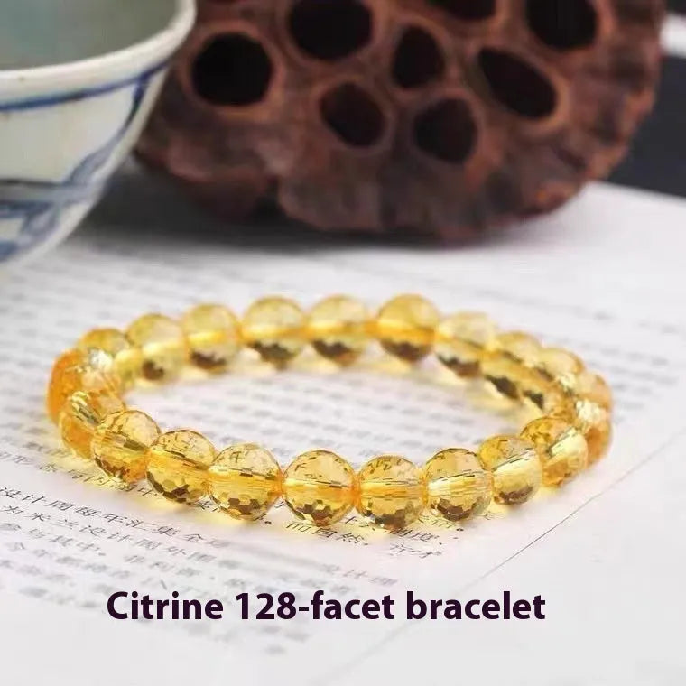 Handmade ametrine bracelet with detailed 128-cut crystal beads on wrist.