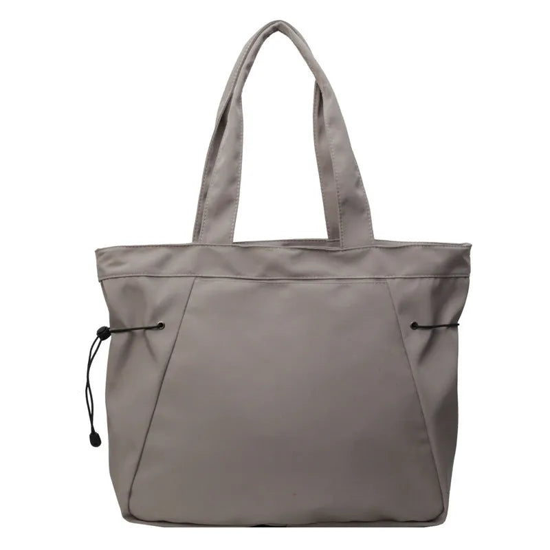 Folding Oxford cloth shoulder tote bag in five colour options showing casual street style