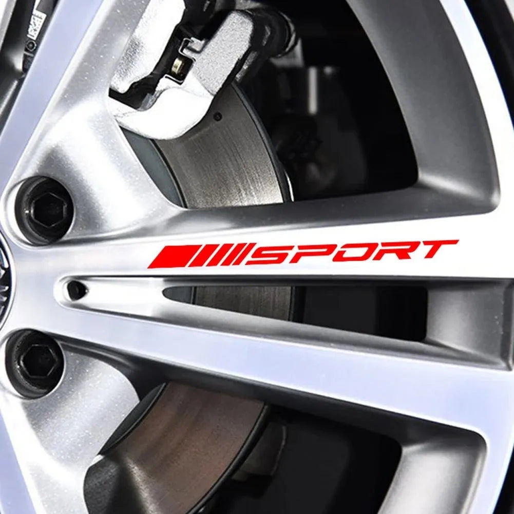 Black sports design car rim sticker on alloy wheel with hollow cut-out pattern