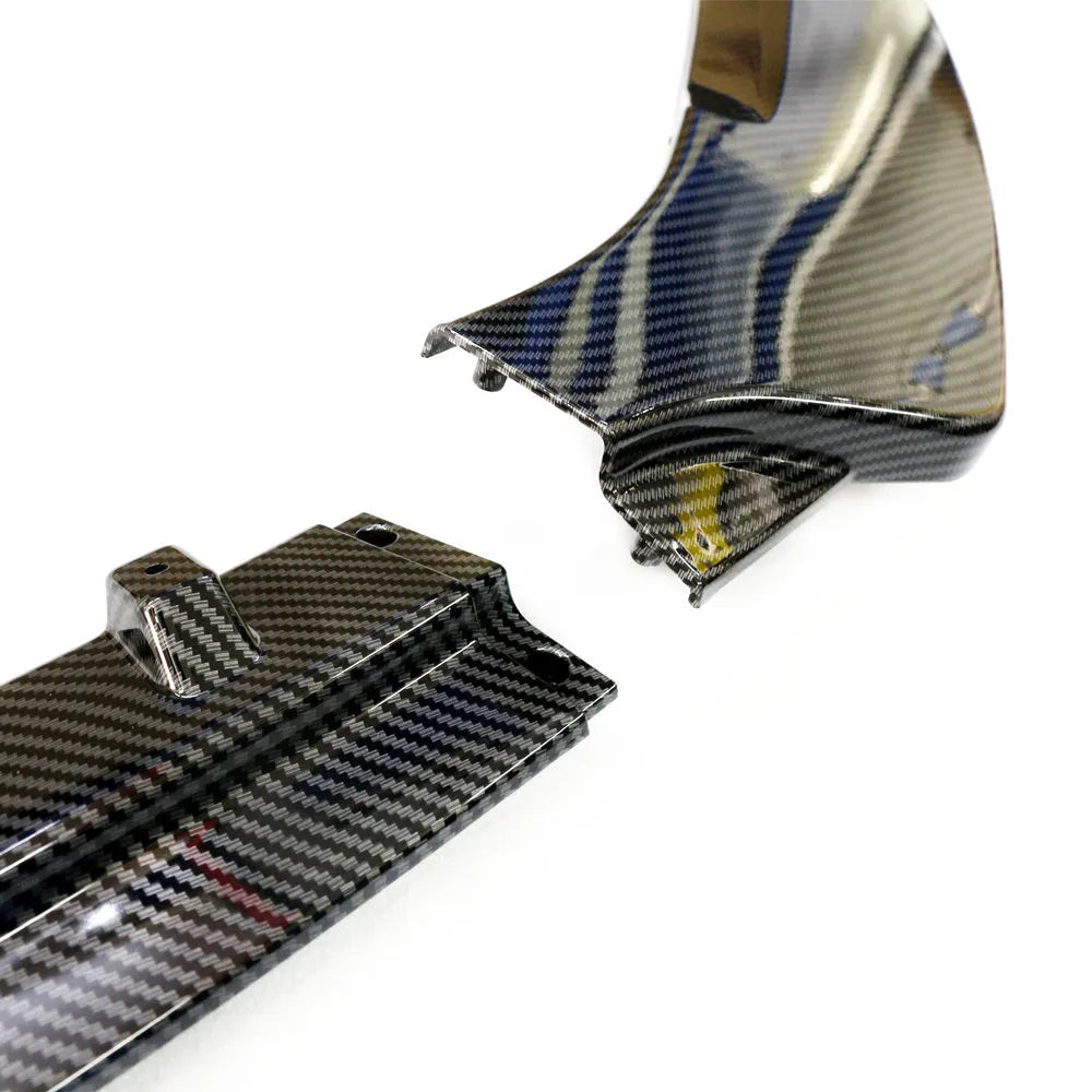Audi A1 8X front splitter retrofit kit with three-section design in black Unksera pattern.