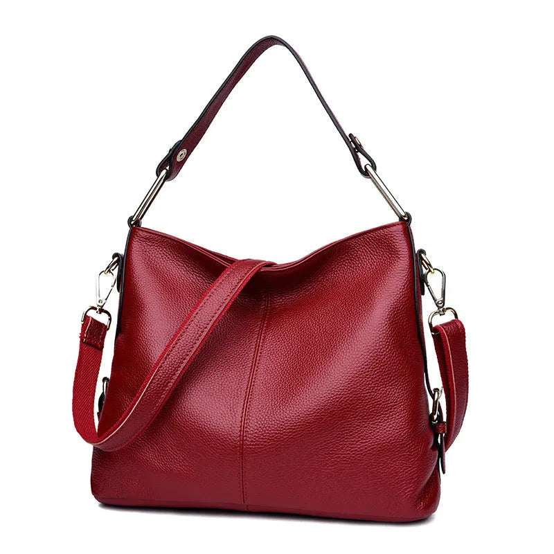 Genuine leather vertical crossbody bag in a square shape with an external sandwich pocket.