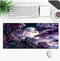 Customisable anime-themed gaming mouse pad with non-slip rubber base on a desk.