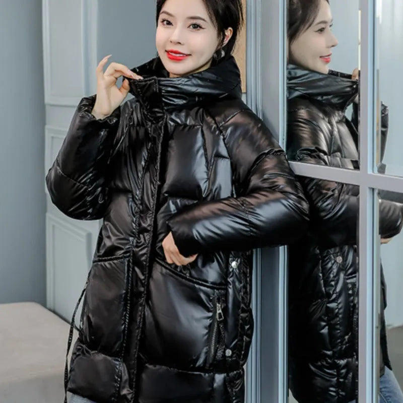 Women's loose fit thick hooded winter jacket in blue, shown on a model.