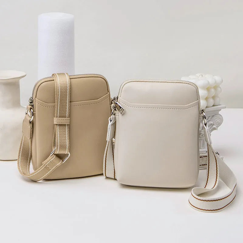 Solid colour PU leather small crossbody phone bag measuring 14.5cm by 5.5cm by 19cm