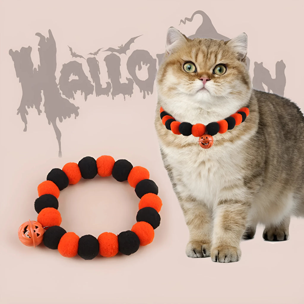 Orange pumpkin Halloween cat collar with green stem on an adjustable strap for pets.