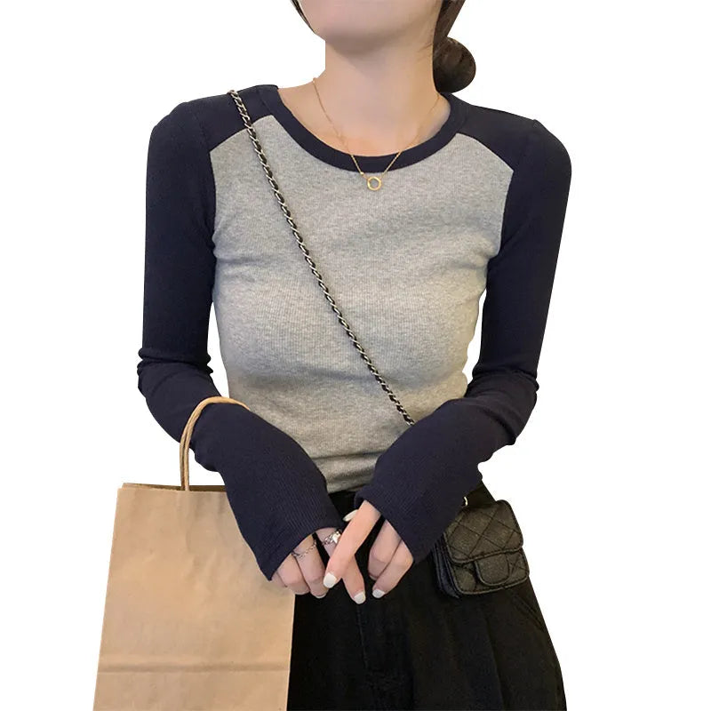 Dark blue oversized slim-fit women's viscose top with long princess sleeves and embroidery detail.