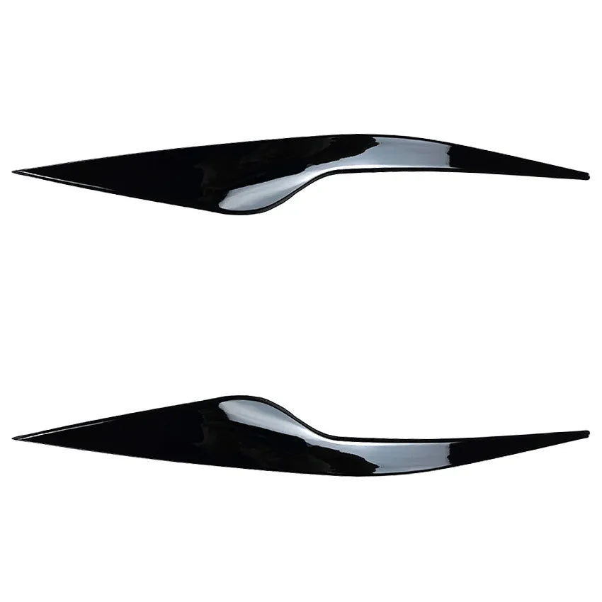 Ford Focus headlight sticker in carbon fiber pattern applied as external eyebrow trim on a car headlight