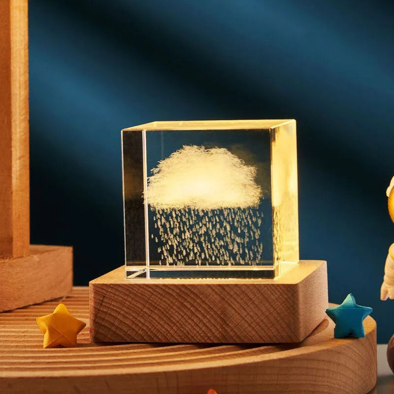 3D transparent crystal cube night lamp with warm light pattern on wooden desktop