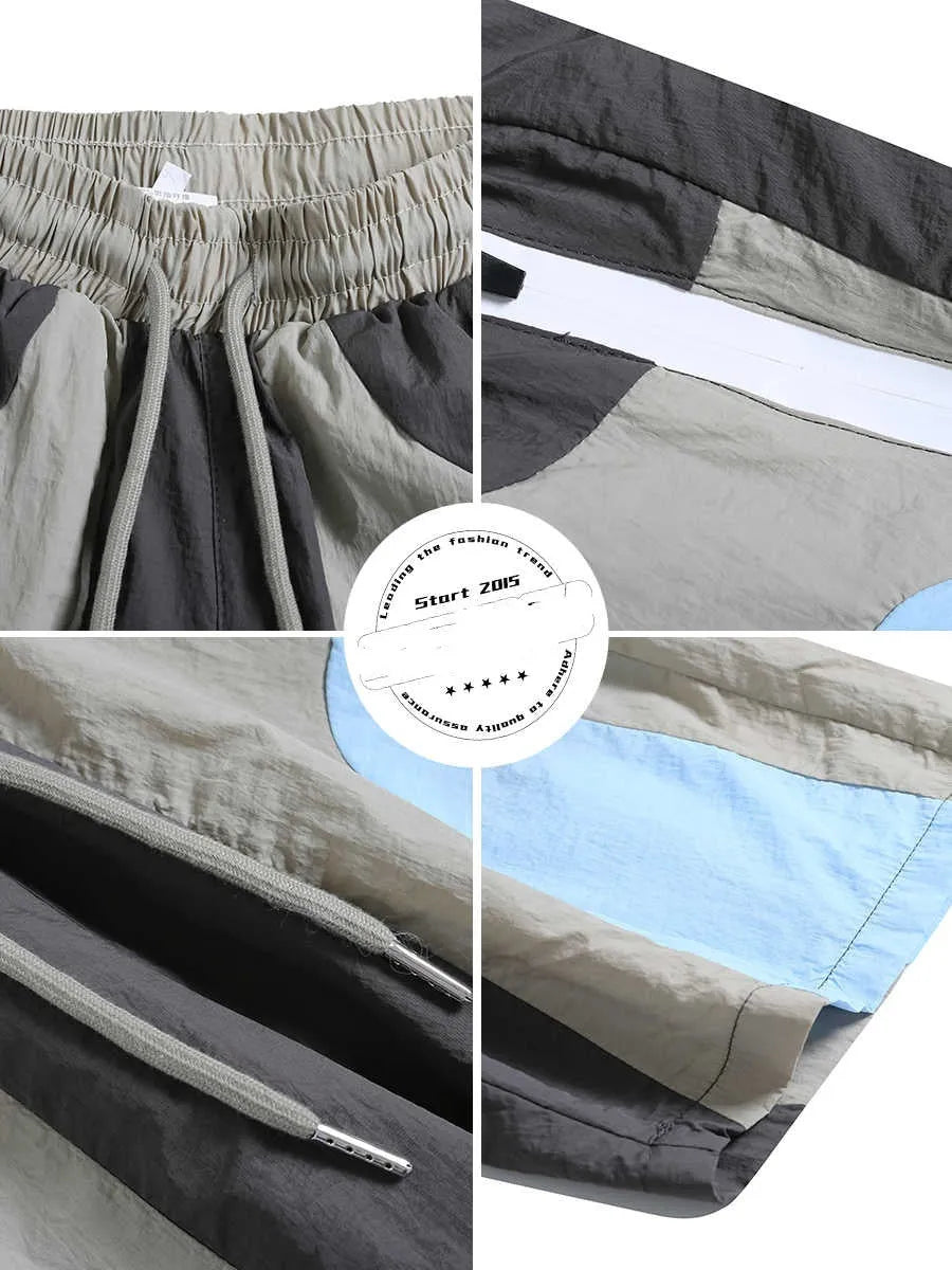 Blue patchwork quick-drying shorts with loose straight-leg styling and micro-elastic waistband