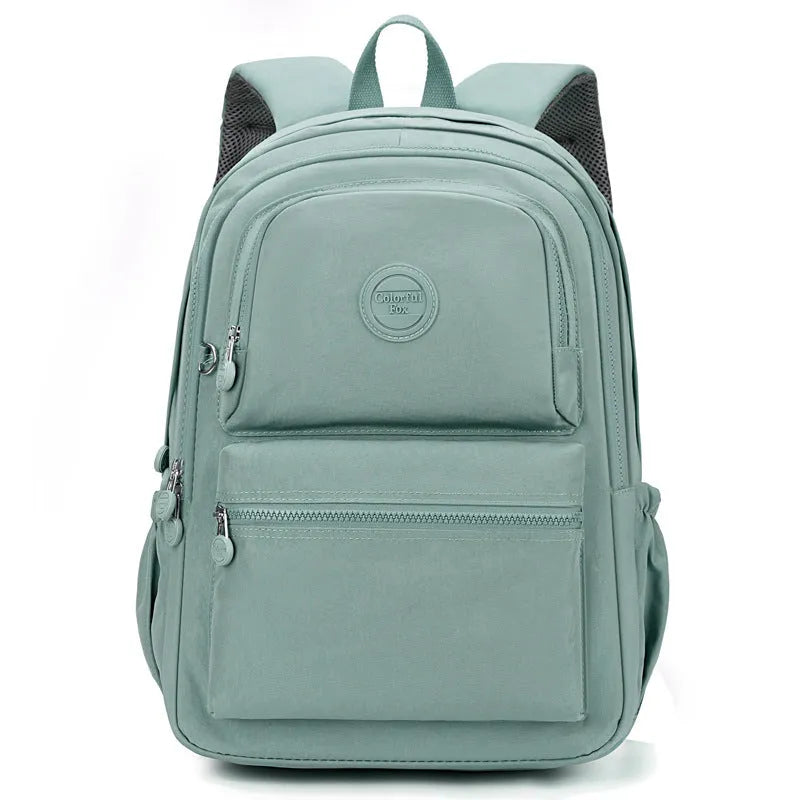 Women's large capacity multi-layer nylon travel backpack in light blue purple with zippered compartments