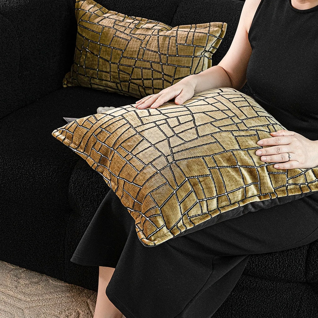 Geometric abstract pattern decorative cushion cover in gold polyester velvet fabric.