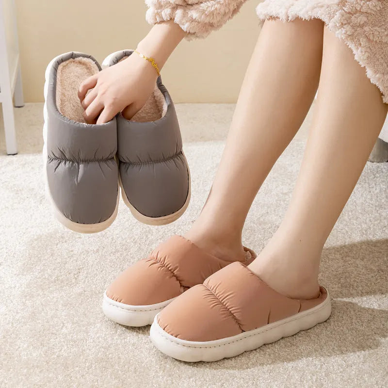 Blue winter house slippers with artificial leather upper, thick rubber sole, and plush lining.