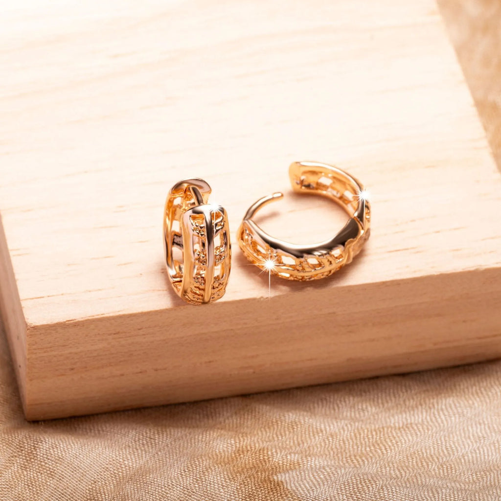 Rose gold plated copper leaf earrings with hollowed out design and heart-shaped detail