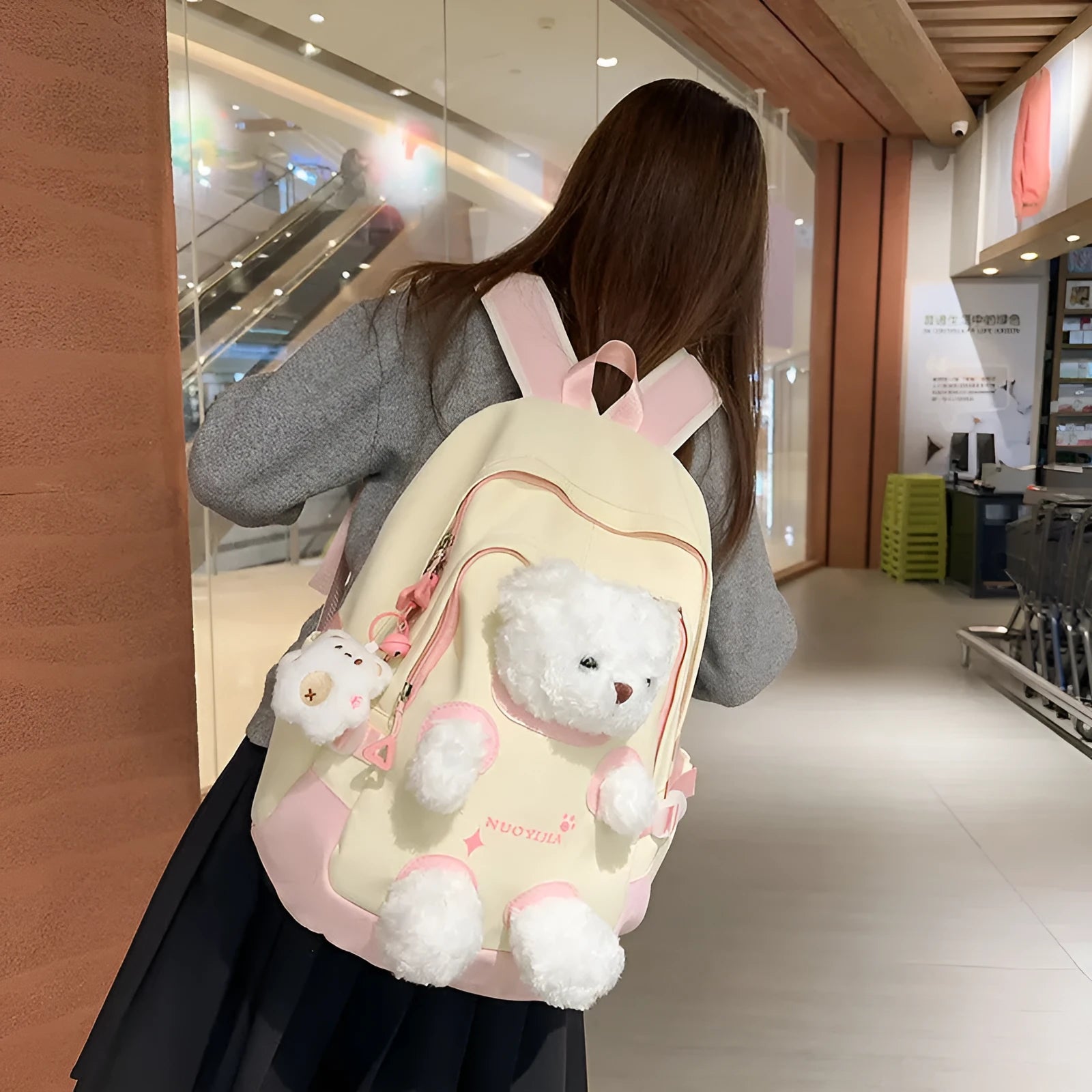 Cute Bear nylon schoolbag with curved shoulder straps, 20-35L capacity, in yellow pink colour
