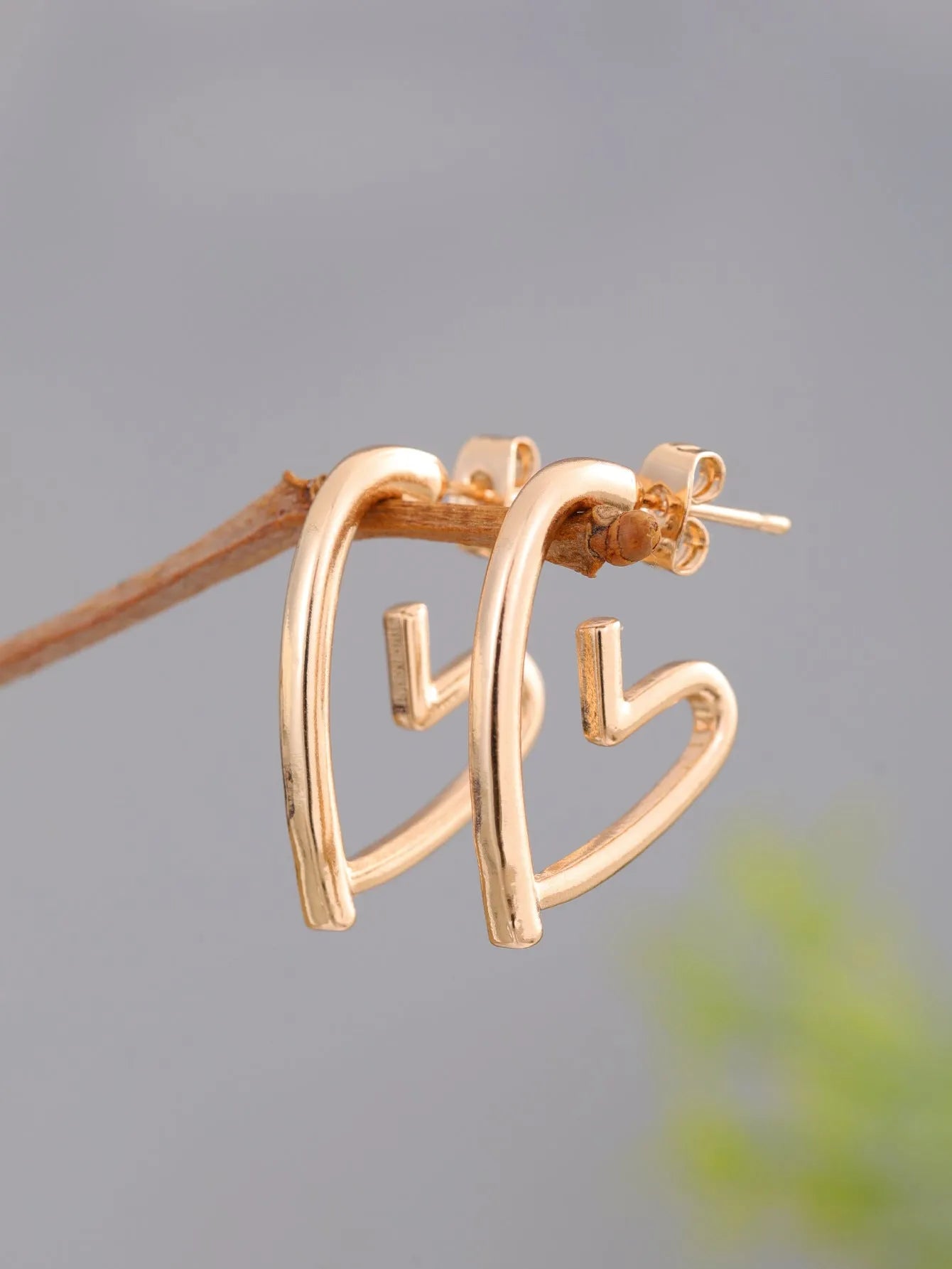 Gold-tone metal simple cold style love dangle earrings for women in golden colour