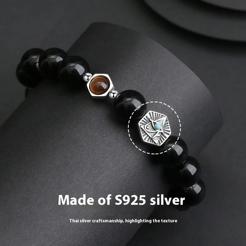 Men's S925 sterling silver God's Eye obsidian bracelet with 8mm geometric beads on a neutral background