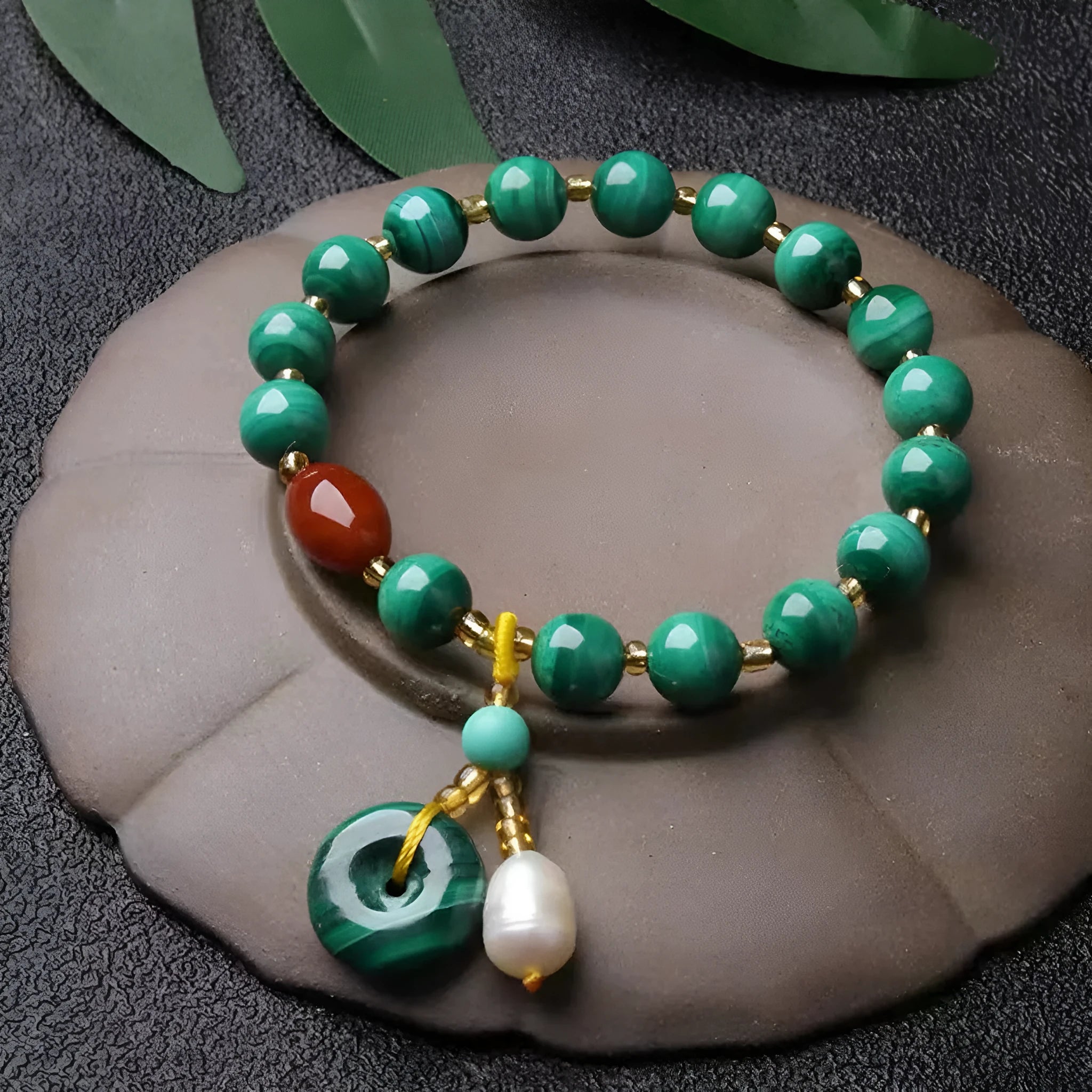 Natural green malachite and red agate barrel bead bracelet measuring 7-8mm with handcrafted unisex design