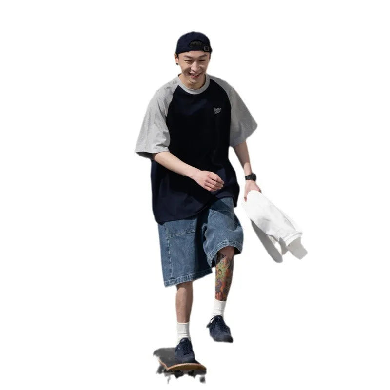 Blue loose-fit men's casual raglan sleeve T-shirt on a hanger.