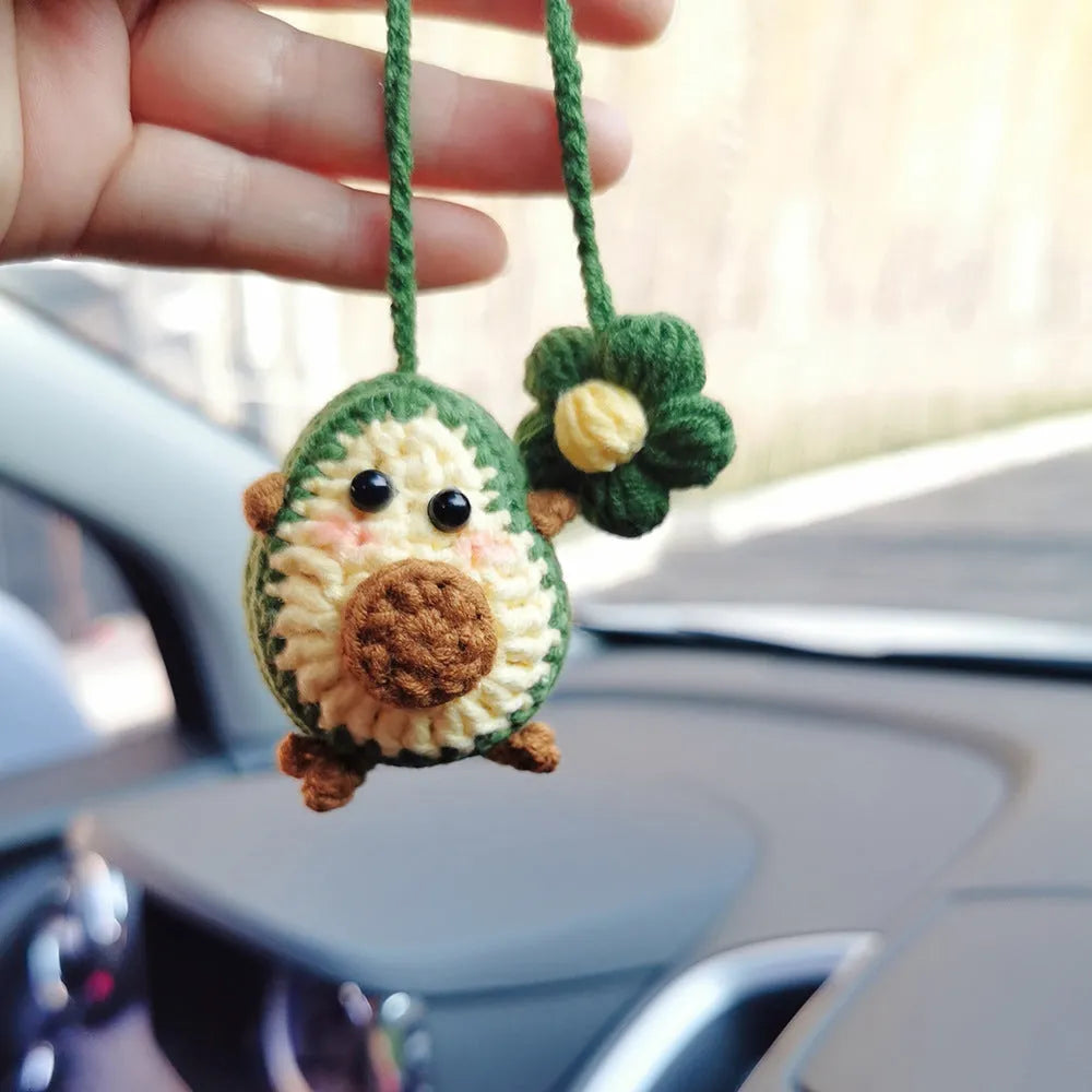 Handmade wool crocheted car pendant in avocado, pink rainbow, and red rainbow colour options