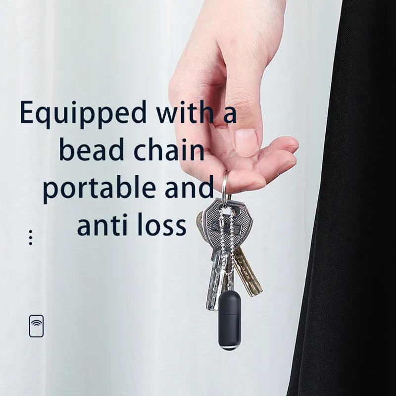 Black capsule-shaped infrared remote control with Lightning, Type-C, and Micro-USB ports.