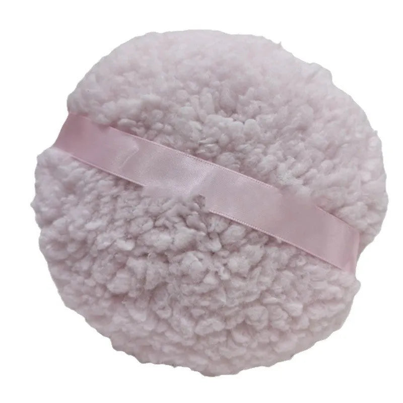 Oversized rectangular plush powder puff for makeup, shown in pink, white, and skin colour options.