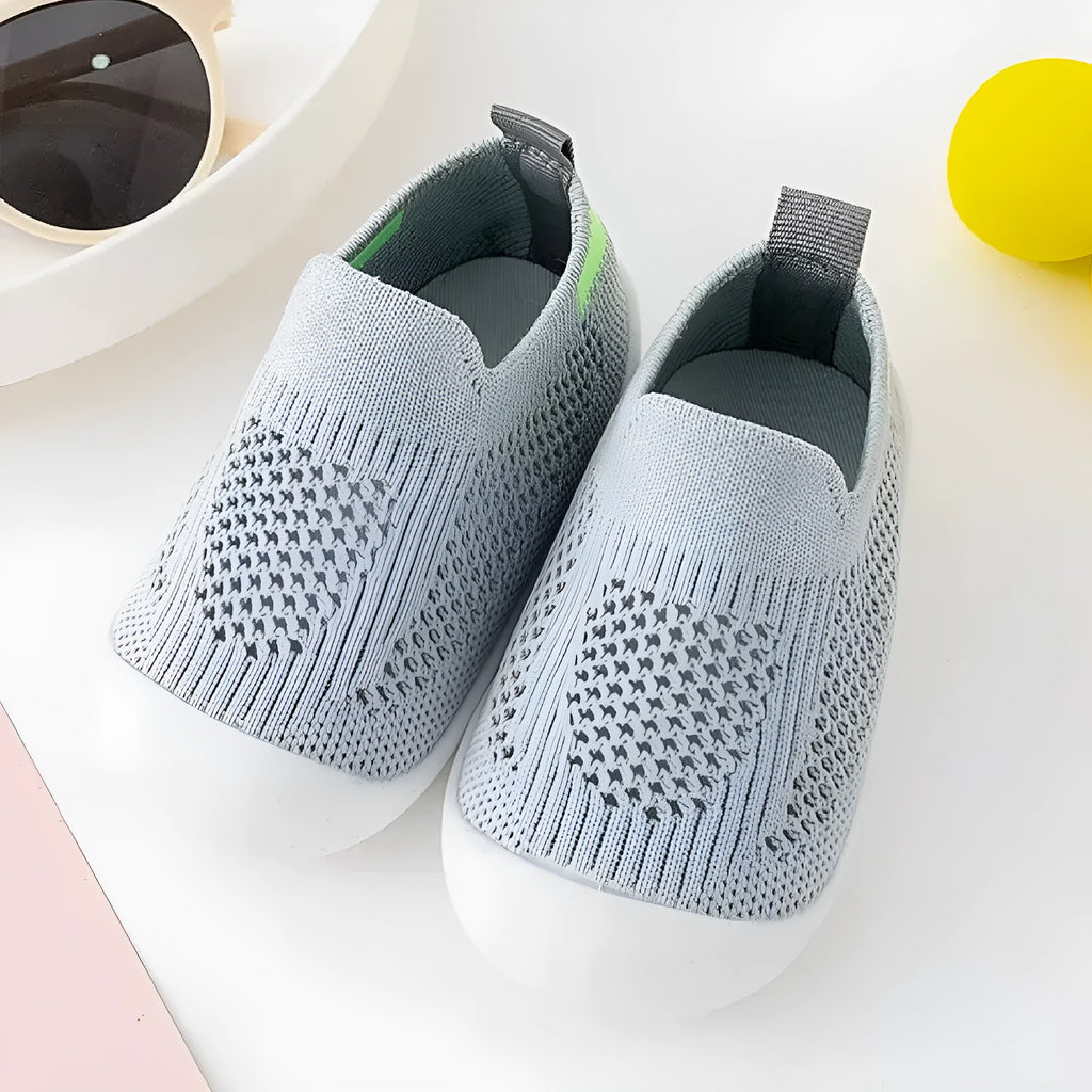 Baby soft sole non-slip walking shoes in cream yellow with fly woven cotton upper and natural rubber sole