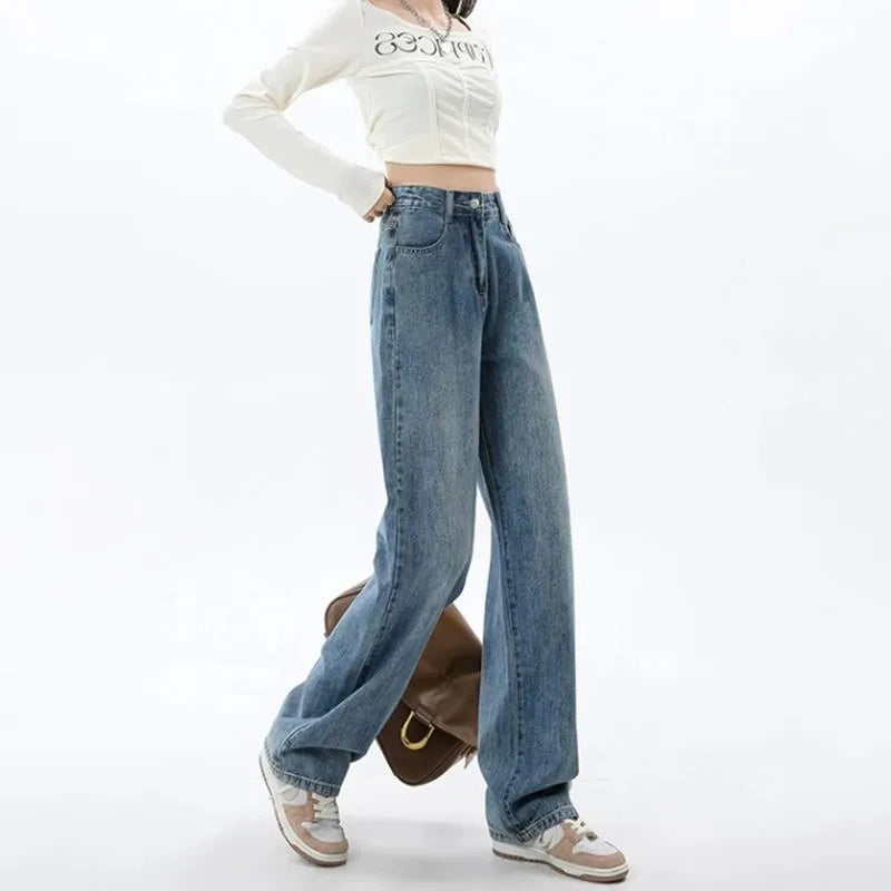 Women's retro blue wide leg jeans with high waist and straight leg design on denim background