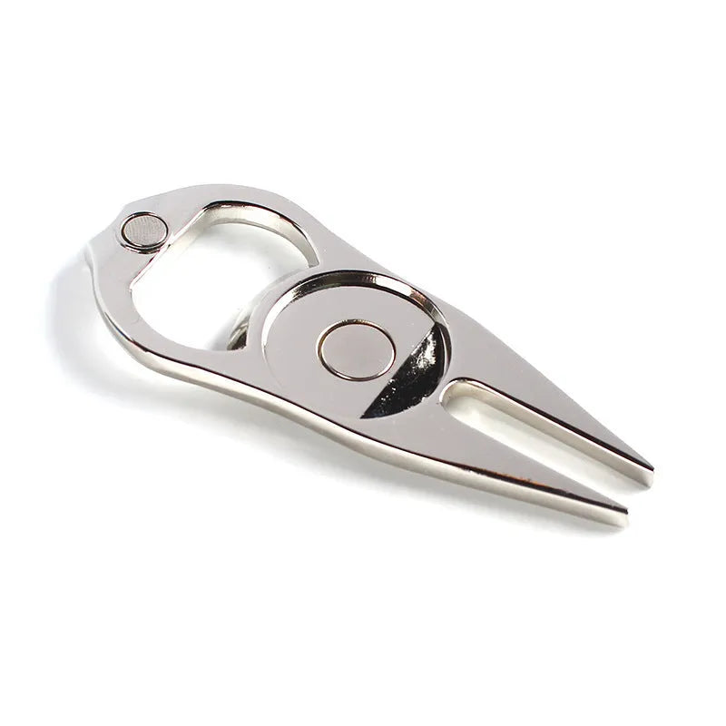 Zinc alloy golf ball yoke and bottle opener tool in black, green or silver on a putting green