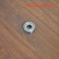 Carbon steel bearing 6000zz with dimensions 10x26x8mm on a white background