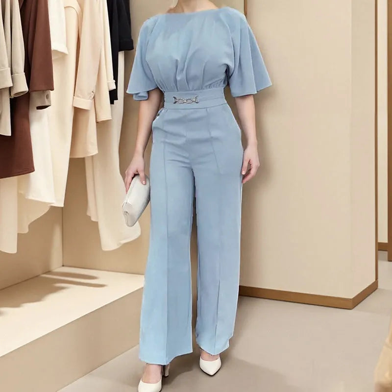 Blue polyester two-piece men's suit with long sleeves and trousers on a hanger