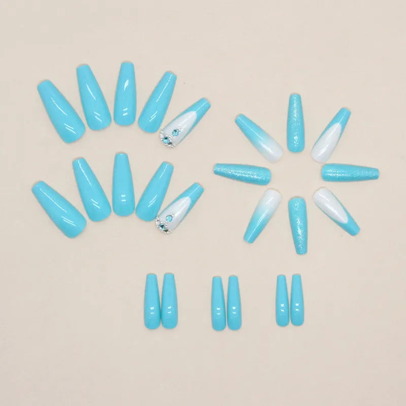 Long ballet-shaped press-on nail patches in solid smart blue diamond colour with glue bottle.