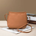 Genuine cowhide messenger bag for women square vertical shape with sewn thread detail in beige