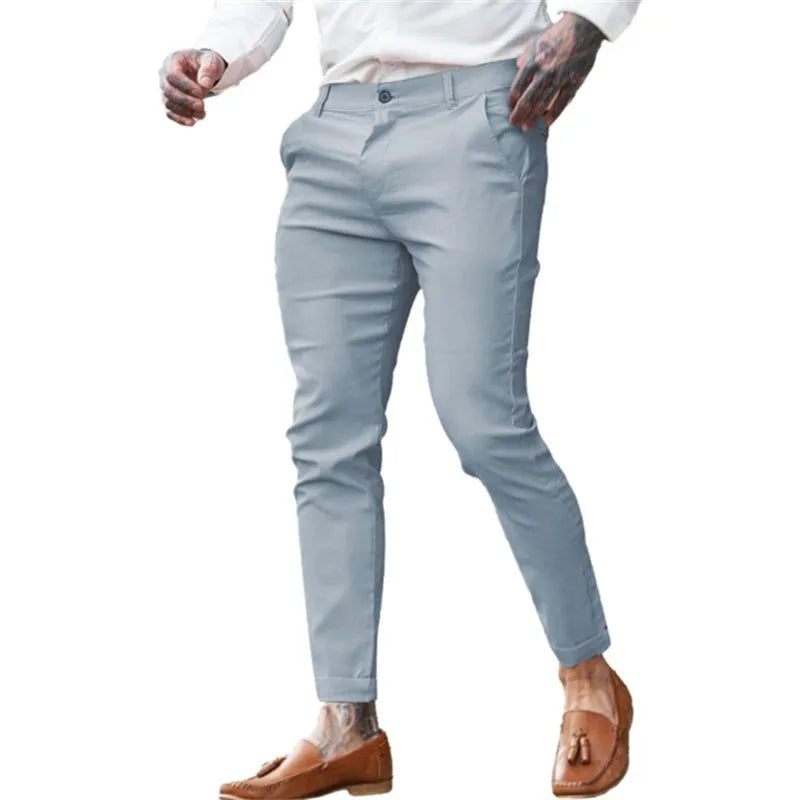 Men's slim fit pencil trousers in cotton twill stretch fabric on a hanger.