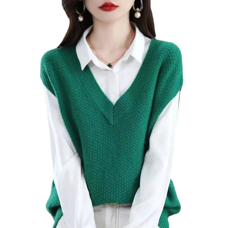 Women's creamy-white V-neck sleeveless knitted vest with 3D pattern texture, laid flat showing front design